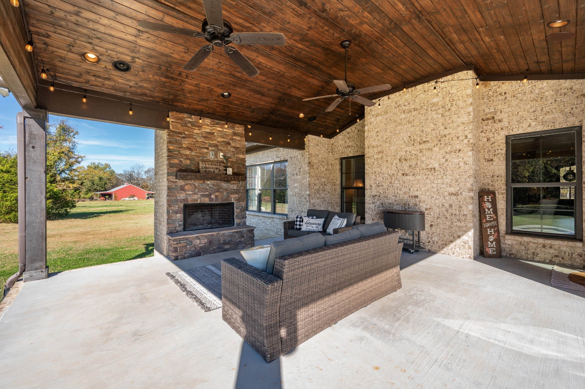 1591 North Lovvorn Road Christiana, TN 37037 - Photo 48 of 62 a living room with patio furniture and a fireplace