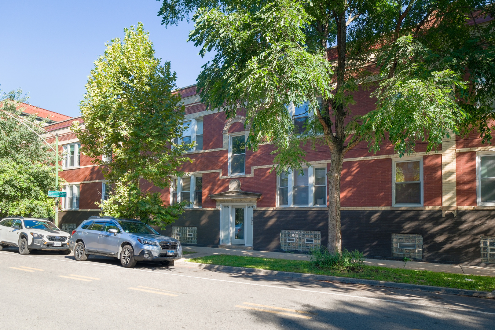 2578 West Lyndale Street, Unit 2 Chicago, IL 60647 - Photo 1 of 17 a view of street with parked cars