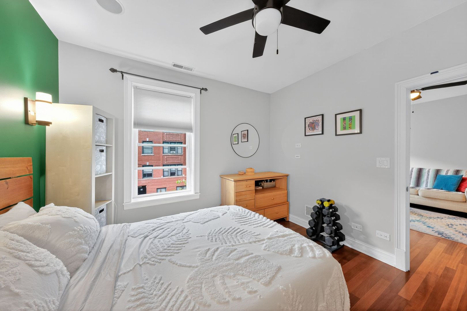 2578 West Lyndale Street, Unit 2 Chicago, IL 60647 - Photo 11 of 17 a bedroom with a bed and a dresser