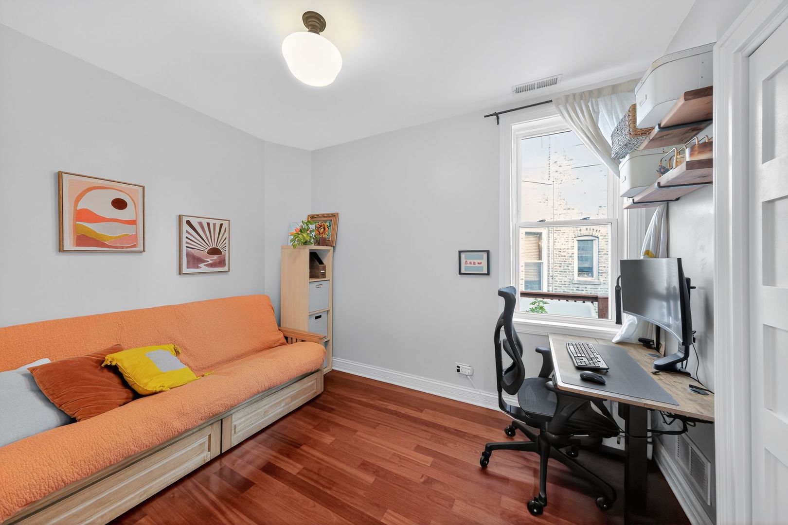 2578 West Lyndale Street, Unit 2 Chicago, IL 60647 - Photo 12 of 17 a view of a livingroom with workspace and a couch