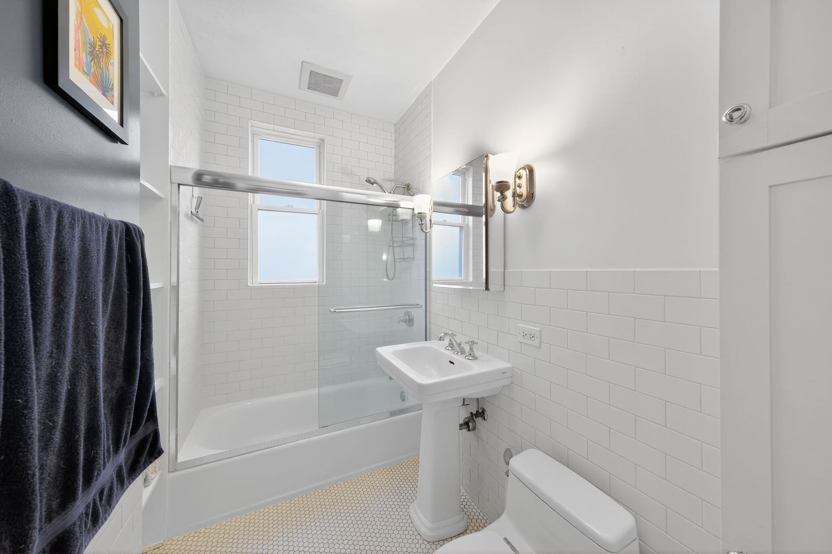 2578 West Lyndale Street, Unit 2 Chicago, IL 60647 - Photo 13 of 17 a bathroom with a sink a toilet and shower