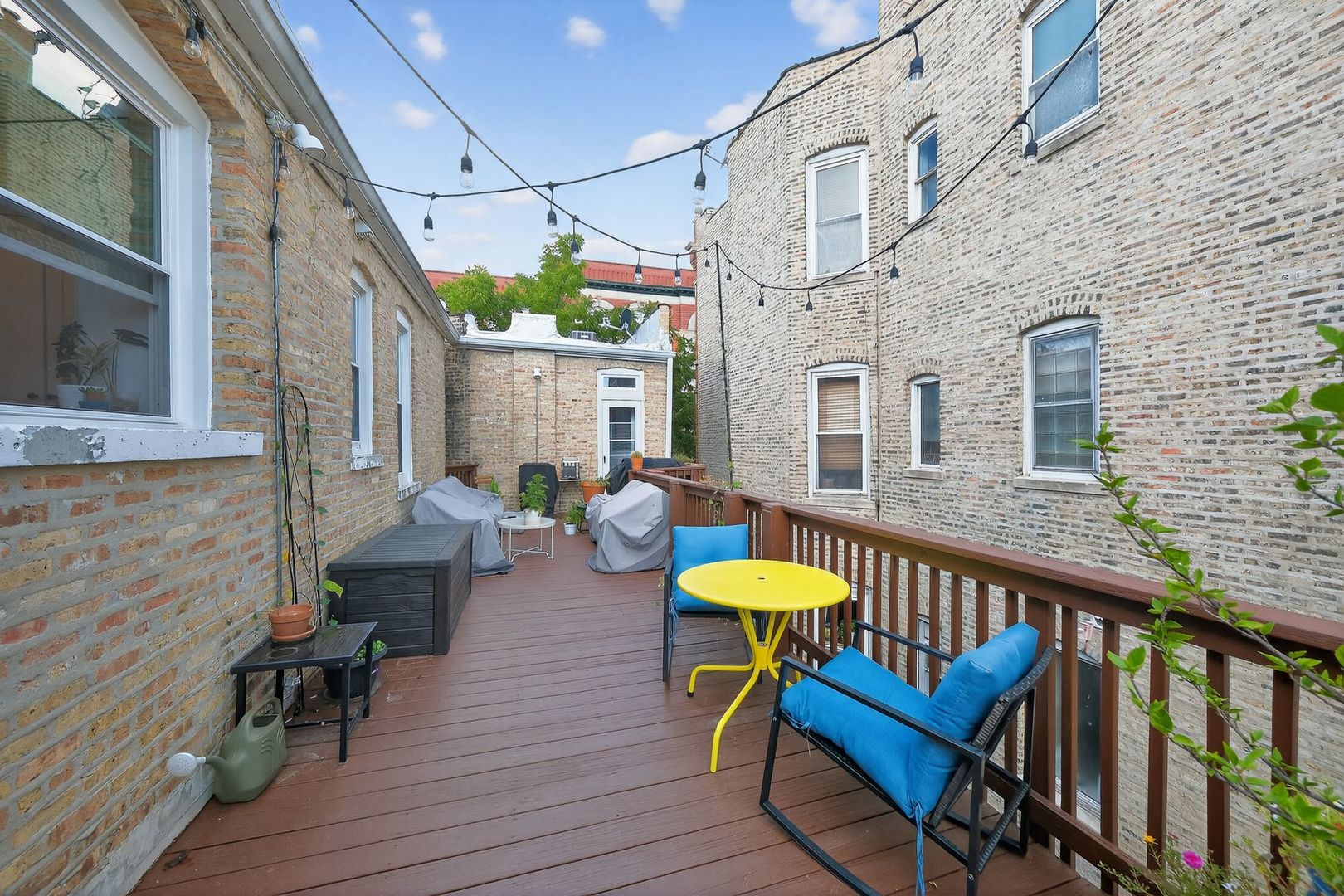 2578 West Lyndale Street, Unit 2 Chicago, IL 60647 - Photo 15 of 17 a view of a chair and table on the wooden deck