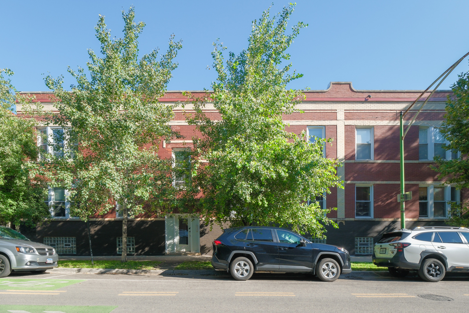 2578 West Lyndale Street, Unit 2 Chicago, IL 60647 - Photo 16 of 17 a car parked in front of a building