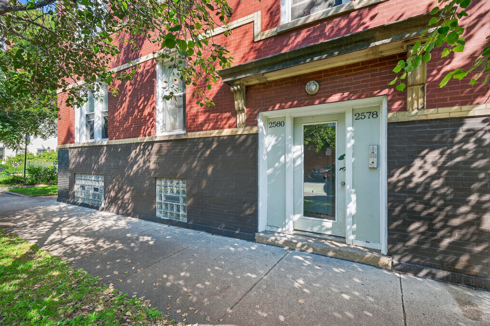 2578 West Lyndale Street, Unit 2 Chicago, IL 60647 - Photo 2 of 17 a front view of a house with a garage