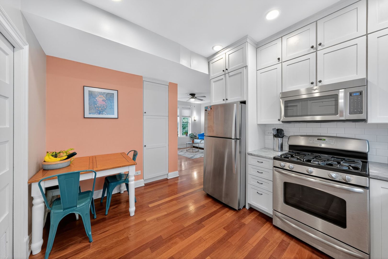 2578 West Lyndale Street, Unit 2 Chicago, IL 60647 - Photo 6 of 17 a kitchen with stainless steel appliances a stove a refrigerator and a refrigerator
