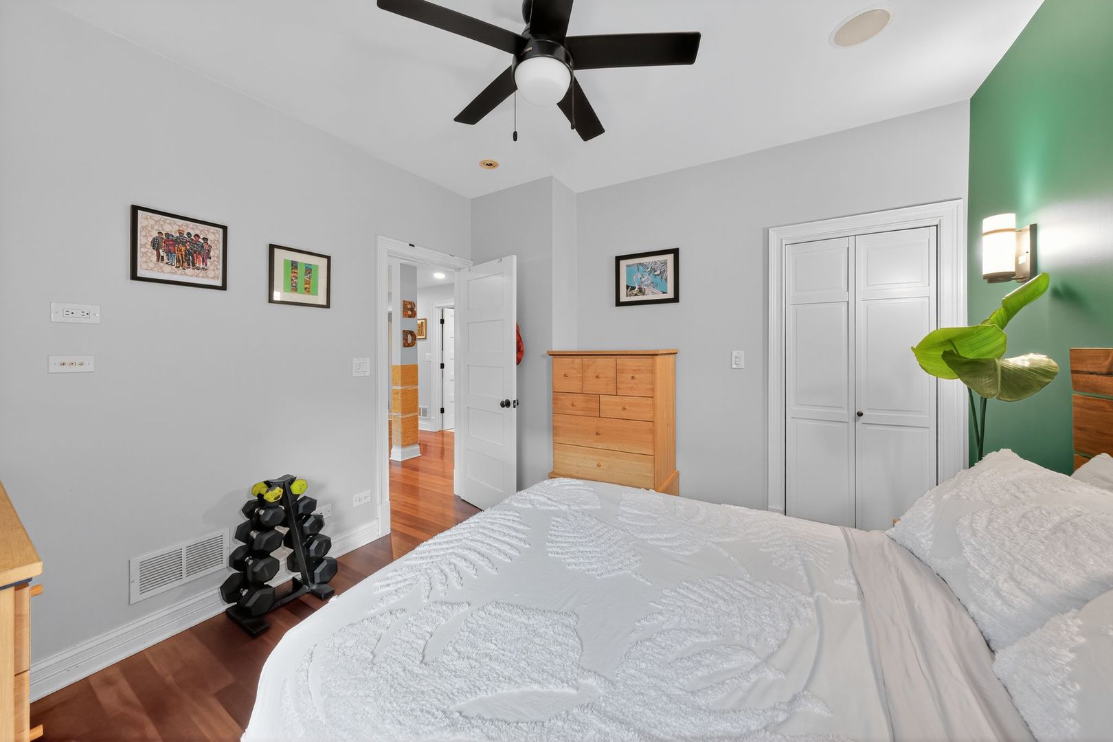 2578 West Lyndale Street, Unit 2 Chicago, IL 60647 - Photo 9 of 17 a bedroom with a bed and a chandelier