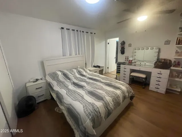 a bedroom with a bed and a fireplace