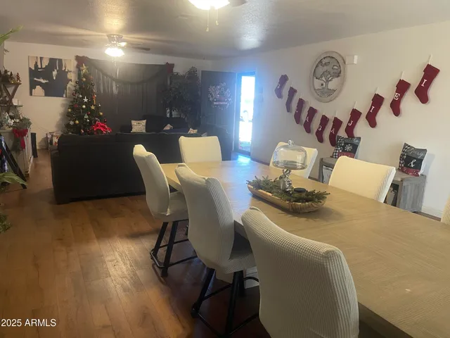 a living room with furniture and flowers