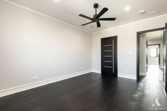 a bathroom with a sink toilet vanity and shower