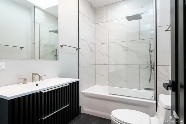 a living room with fireplace furniture and a flat screen tv