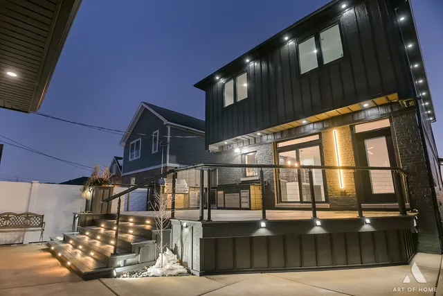 a living room with furniture flat screen tv and a large window