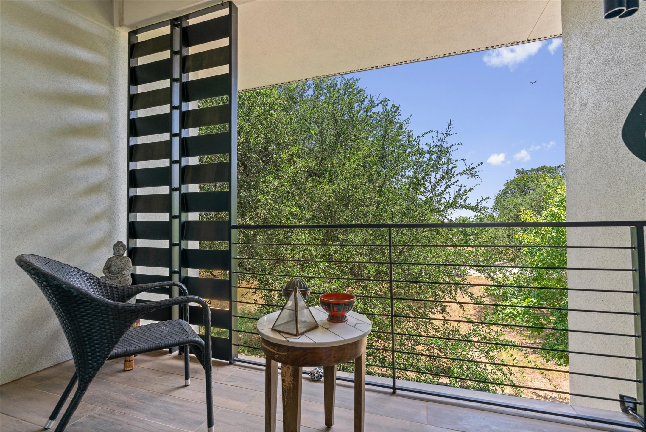 408 Starlight Village Loop Leander, TX 78641 - Photo 31 of 40 An inviting balcony space offers tranquil views of the verdant surroundings, ideal for quiet moments.