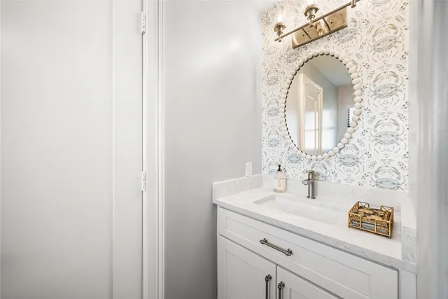 a bathroom with a sink and a mirror