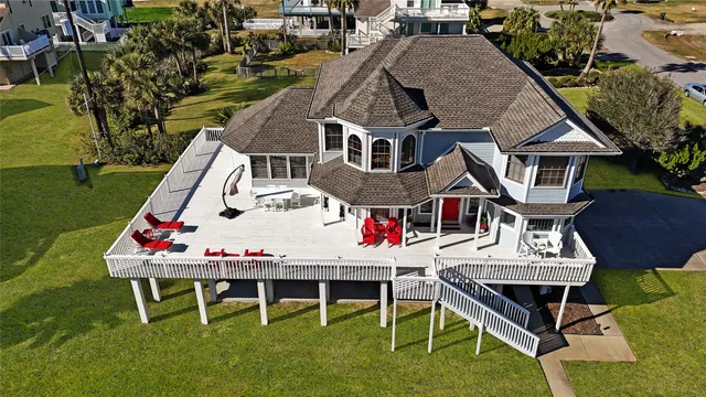 a aerial view of a house with a yard