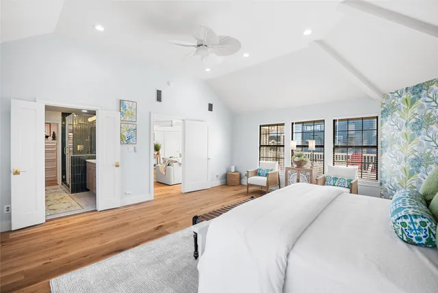 a room with a bed and a large window