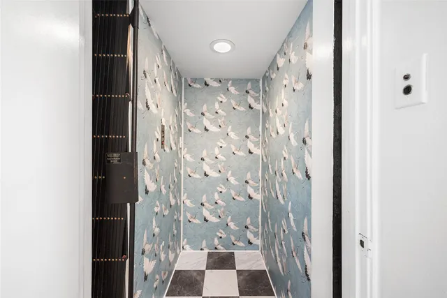 a front view of a house with large windows