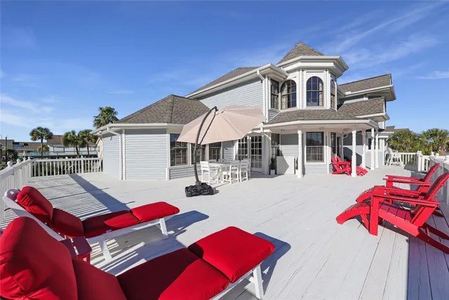 an aerial view of a house with a big yard