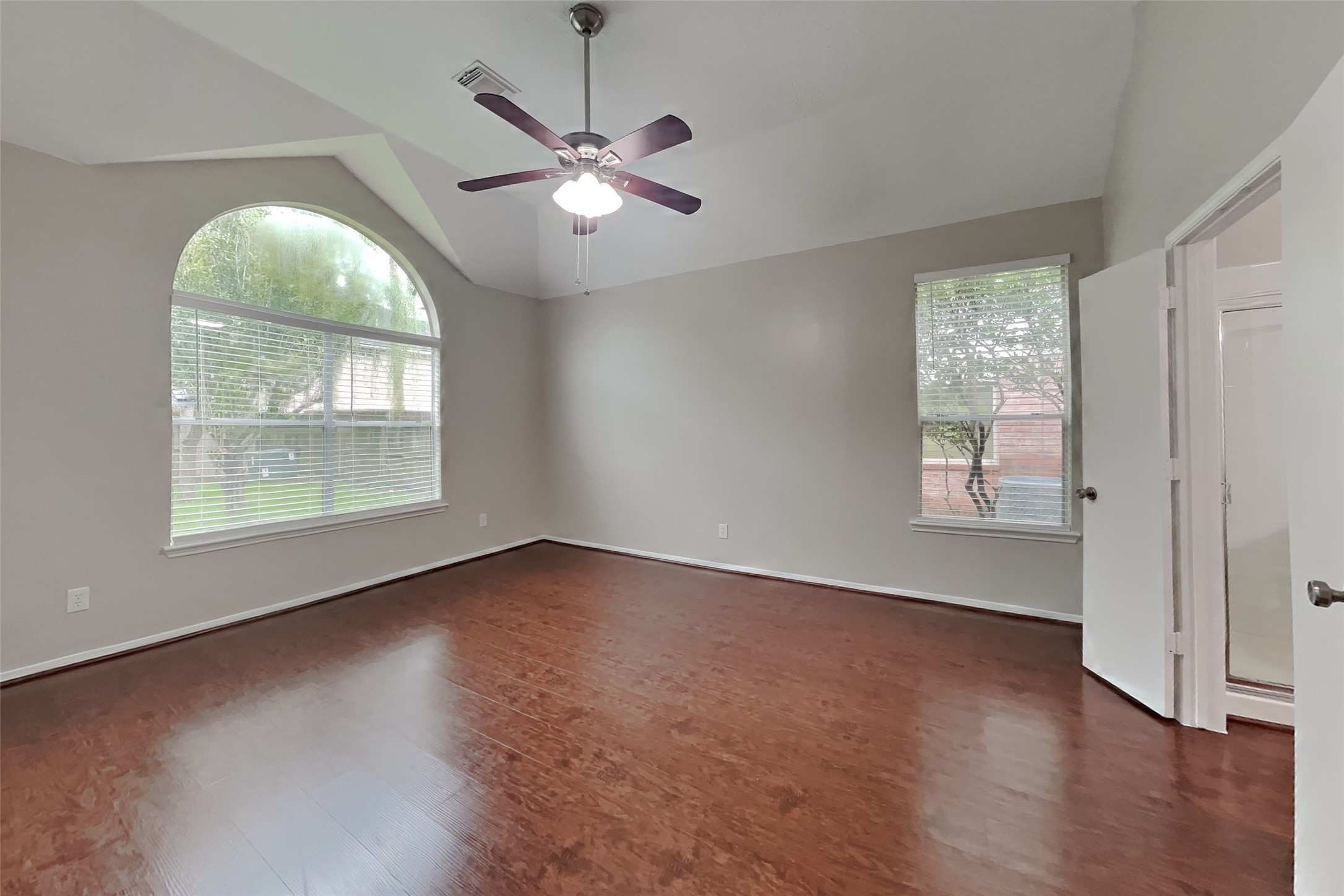 619 Bending Bough Drive Spring, TX 77388 - Photo 8 of 22 an empty room with wooden floor chandelier and windows