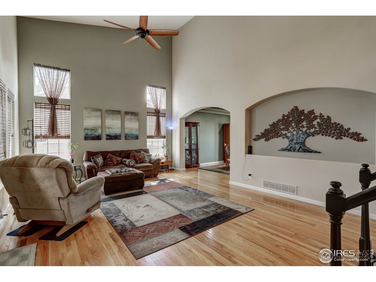 709 Glenarbor Circle Longmont, CO 80504 - Photo 11 of 40 a living room with furniture and wooden floor