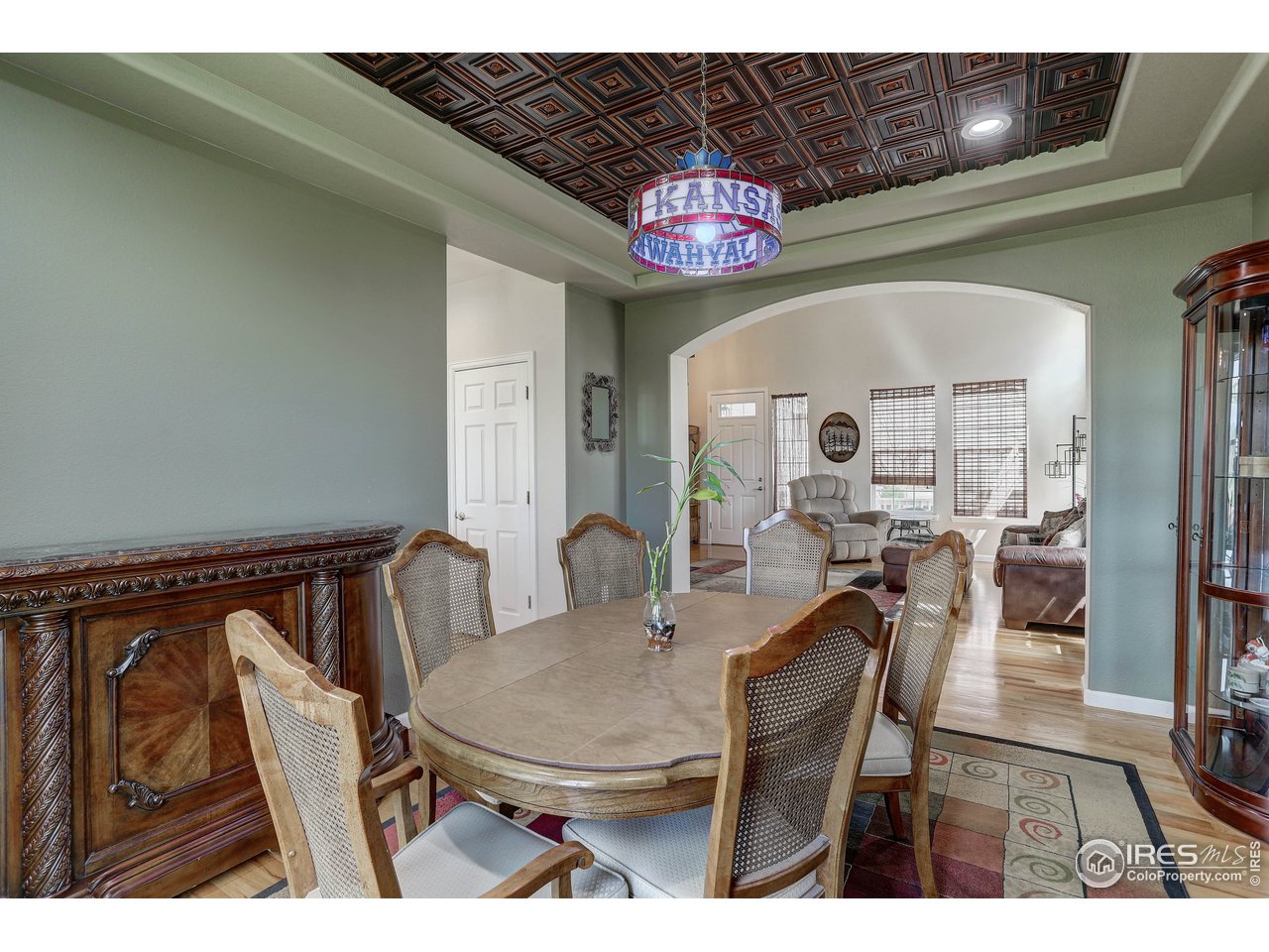 709 Glenarbor Circle Longmont, CO 80504 - Photo 13 of 40 a view of a dining room with furniture and a chandelier