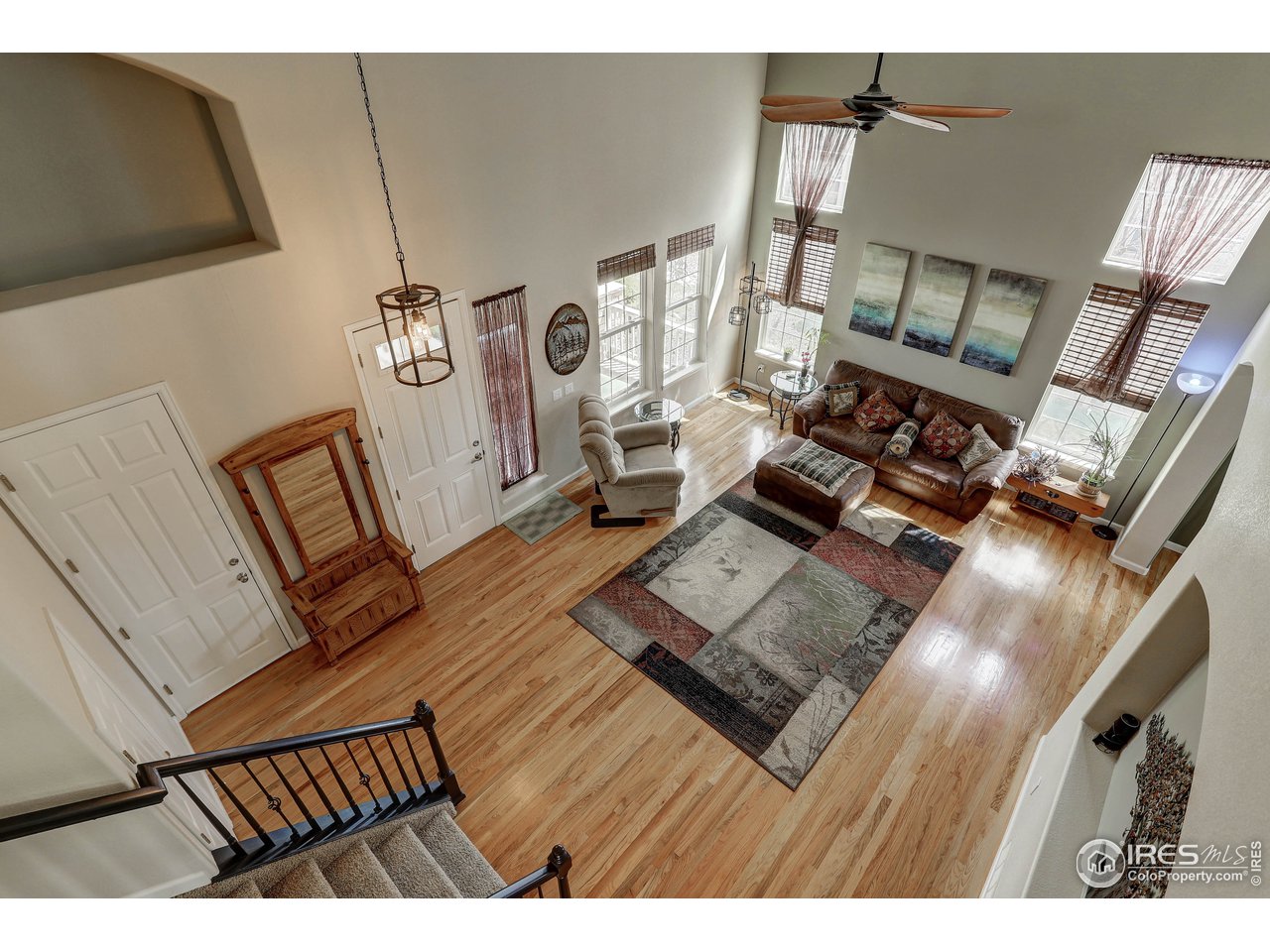 709 Glenarbor Circle Longmont, CO 80504 - Photo 25 of 40 a living room with furniture and a wooden floor