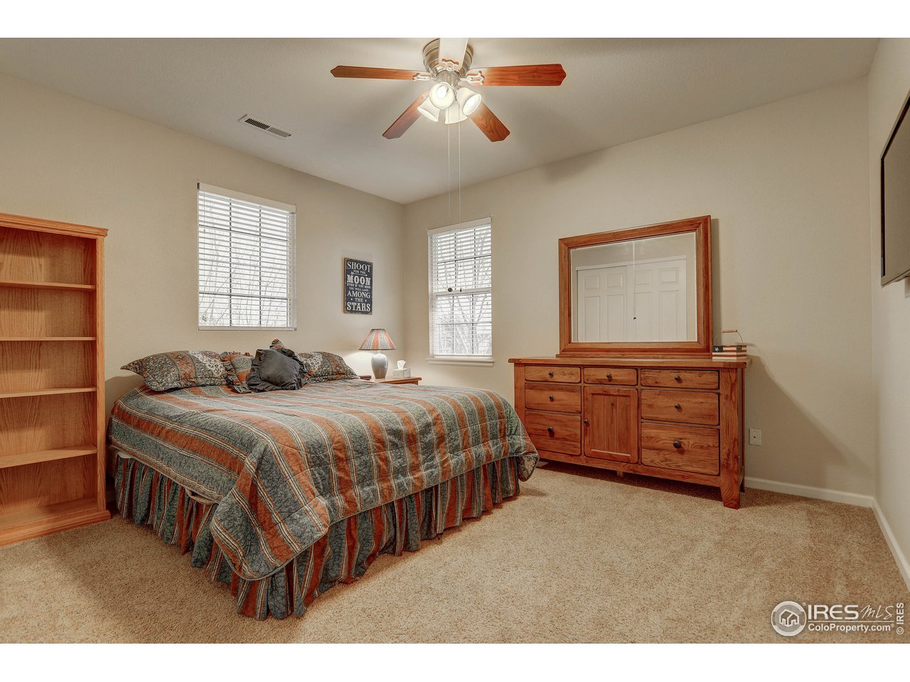 709 Glenarbor Circle Longmont, CO 80504 - Photo 27 of 40 a bedroom with a bed and a dresser
