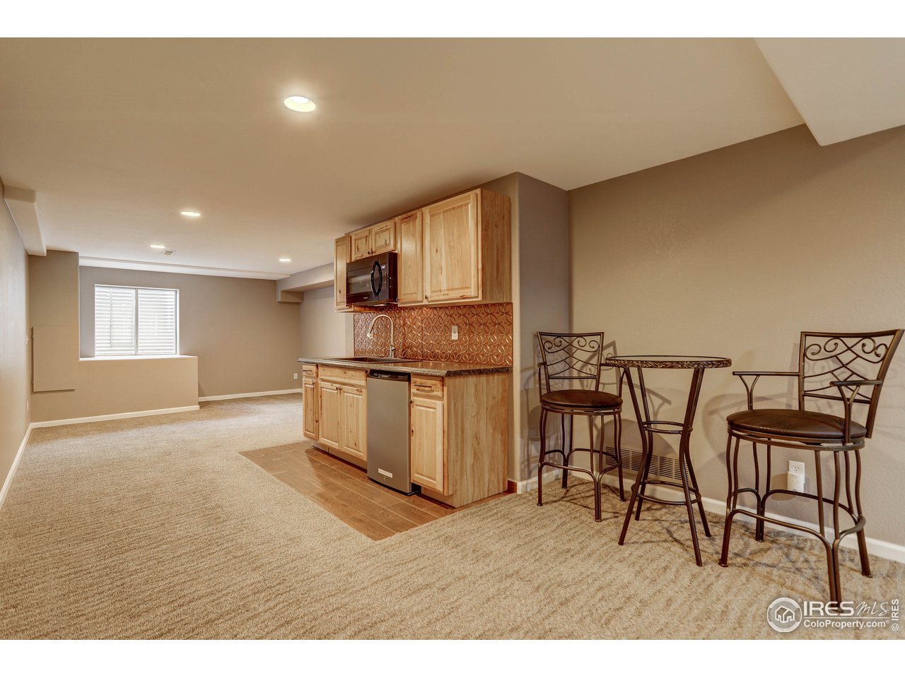 709 Glenarbor Circle Longmont, CO 80504 - Photo 30 of 40 a kitchen with cabinets and wooden floor