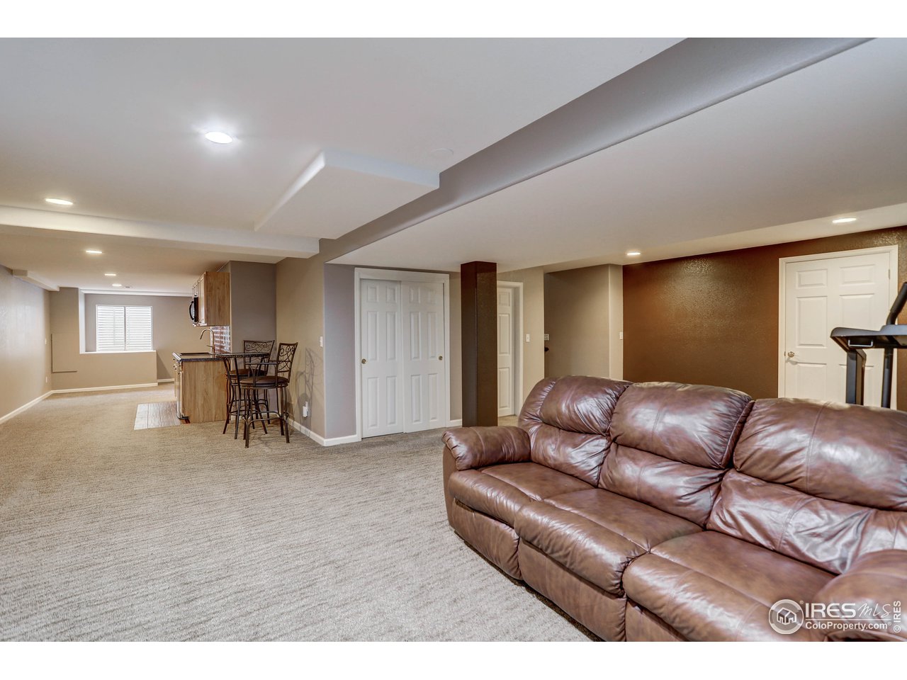 709 Glenarbor Circle Longmont, CO 80504 - Photo 32 of 40 a living room with furniture and a table
