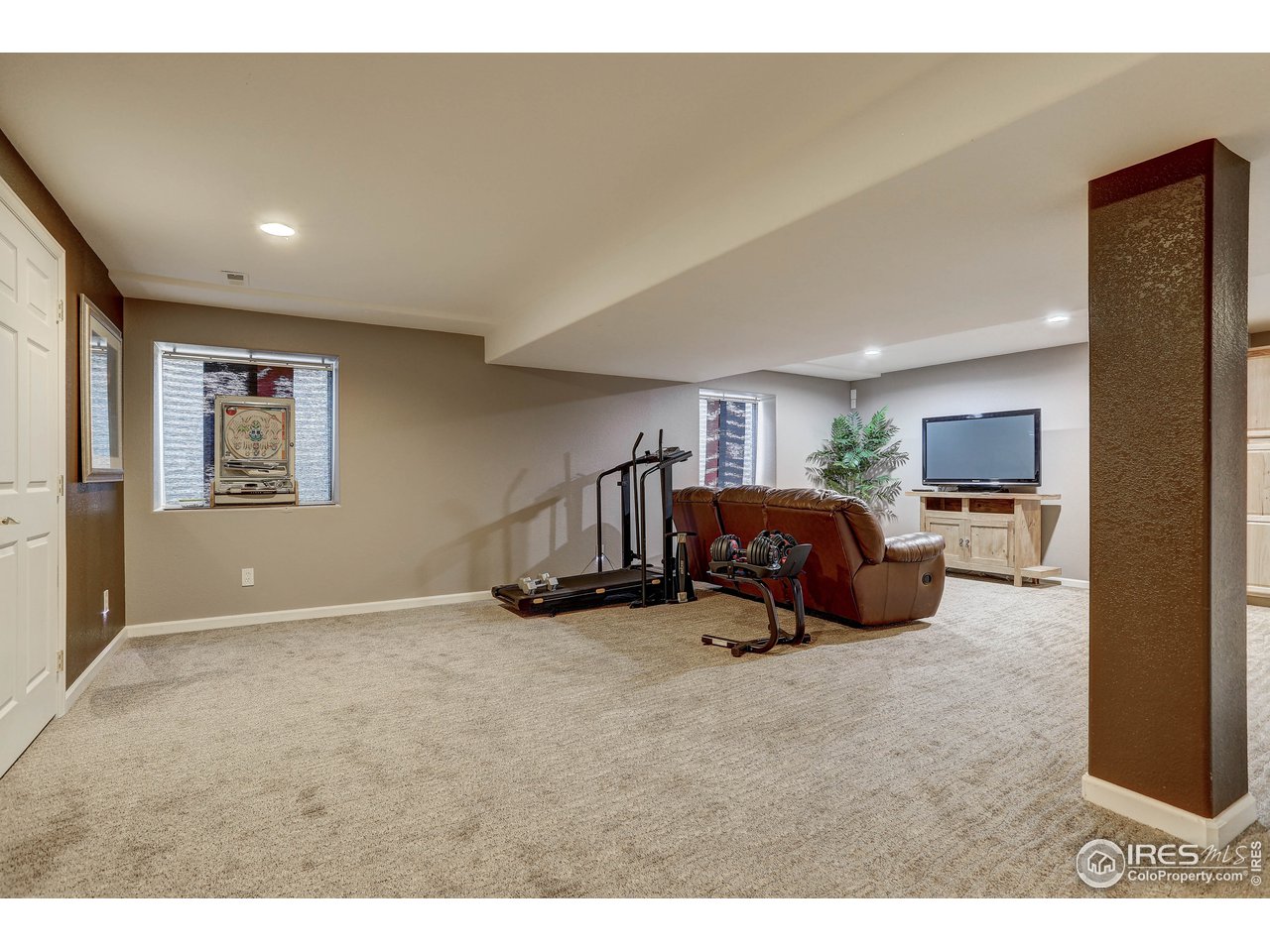 709 Glenarbor Circle Longmont, CO 80504 - Photo 33 of 40 a room with a bed and a view of kitchen