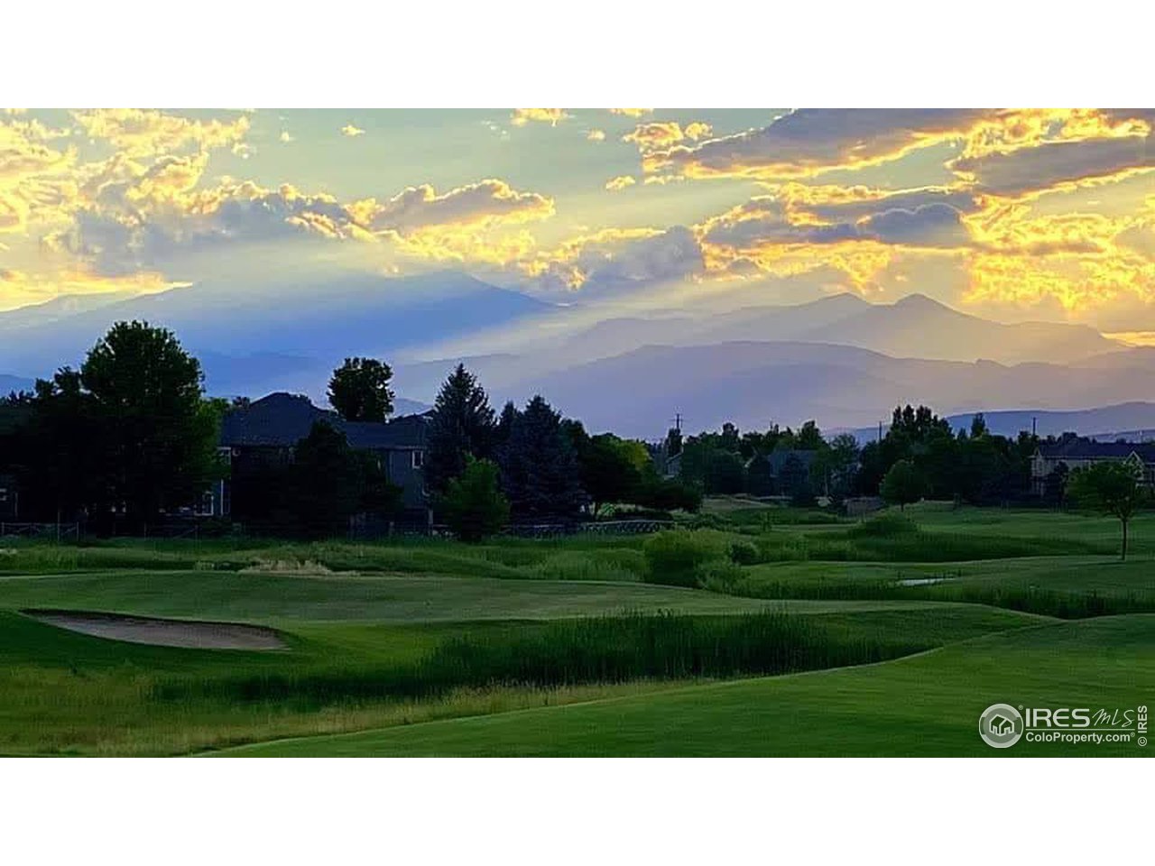 709 Glenarbor Circle Longmont, CO 80504 - Photo 40 of 40 a black and white view of a lake in a big yard with a yard