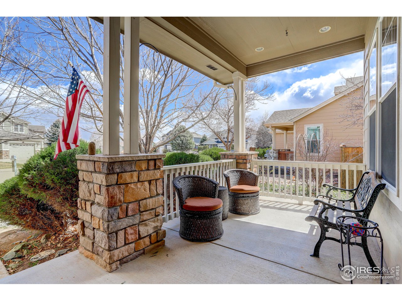 709 Glenarbor Circle Longmont, CO 80504 - Photo 7 of 40 a balcony with wooden floor outdoor seating and city view