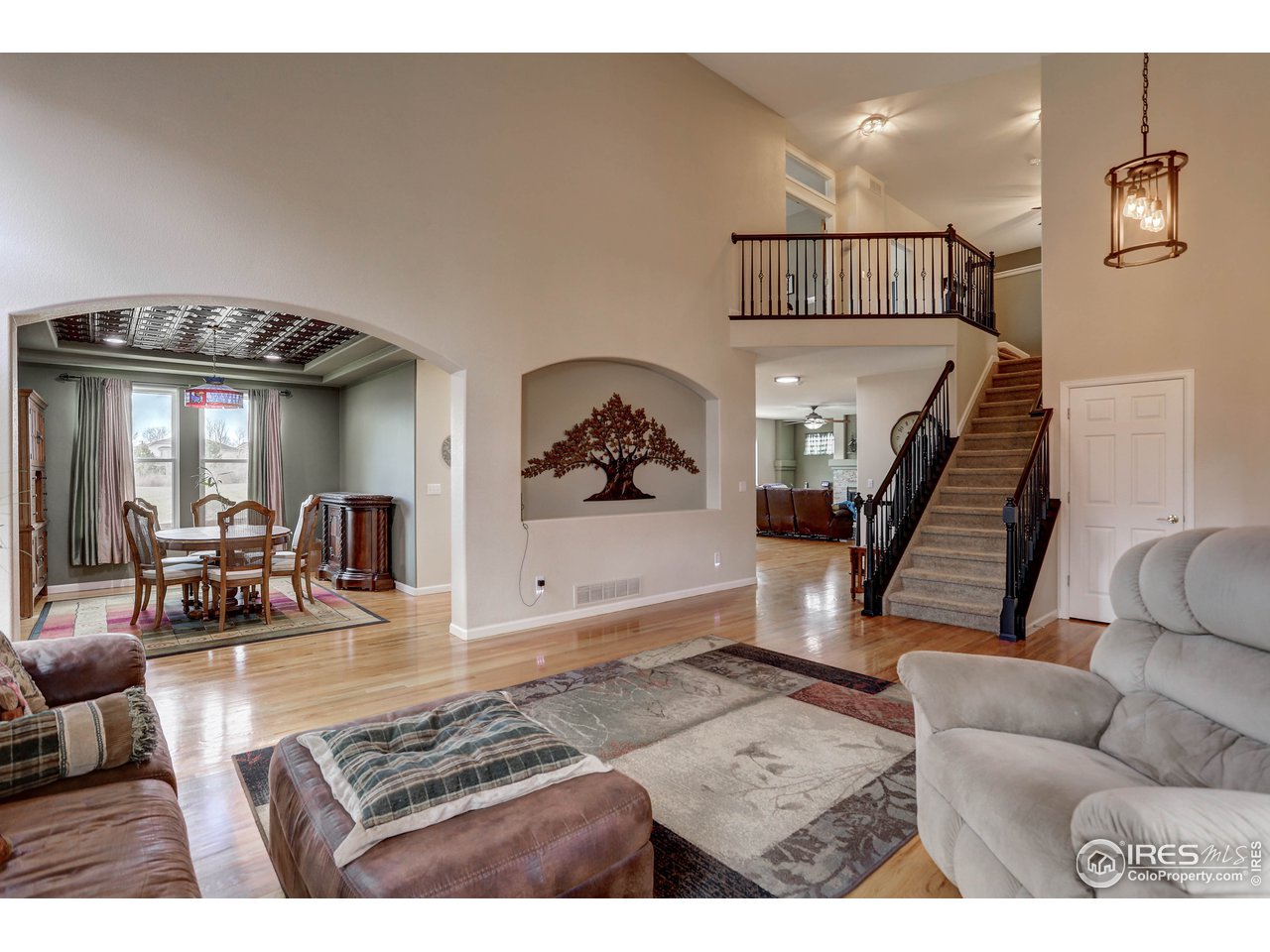 709 Glenarbor Circle Longmont, CO 80504 - Photo 8 of 40 a living room with furniture and wooden floor