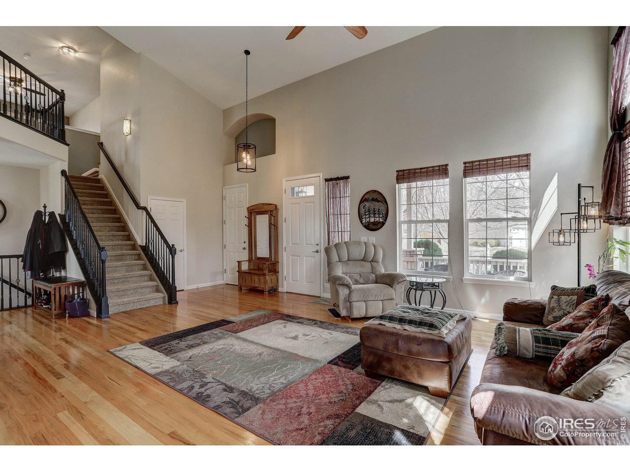 709 Glenarbor Circle Longmont, CO 80504 - Photo 10 of 40 a living room with furniture and a wooden floor
