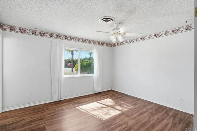 a view of a room with window and wooden floor