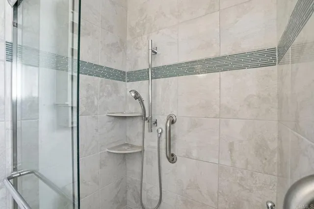 a bathroom with a shower and a sink