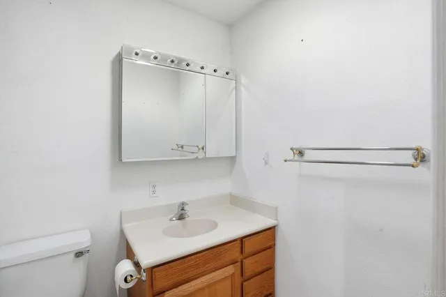 a bathroom with a sink a mirror and a shower