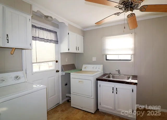 a view of storage and utility room with washer and dryer