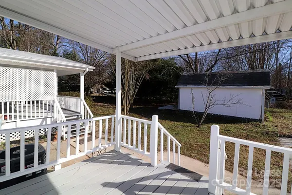 a view of balcony with furniture
