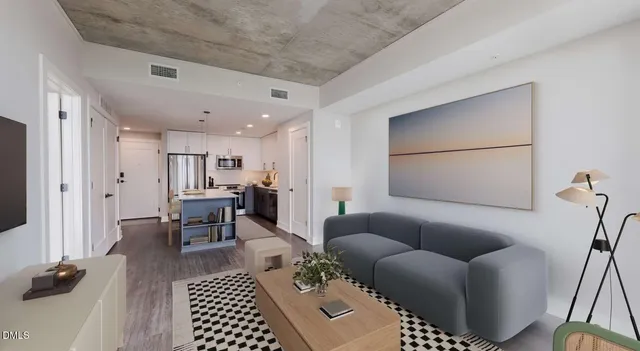 a bedroom with a large bed and a potted plant