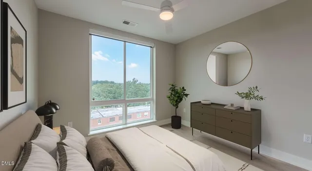 a living room with furniture and flowers