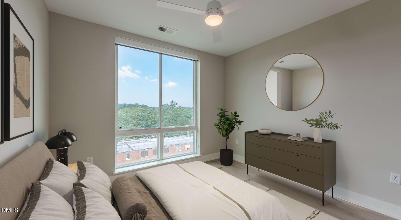 1000 Hammell Drive, Unit S3 Raleigh, NC 27603 - Photo 29 of 35 a bedroom with a bed and a mirror