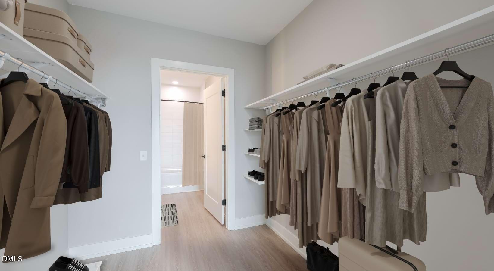 1000 Hammell Drive, Unit S3 Raleigh, NC 27603 - Photo 31 of 35 a view of walk in closet with clothes and shoes