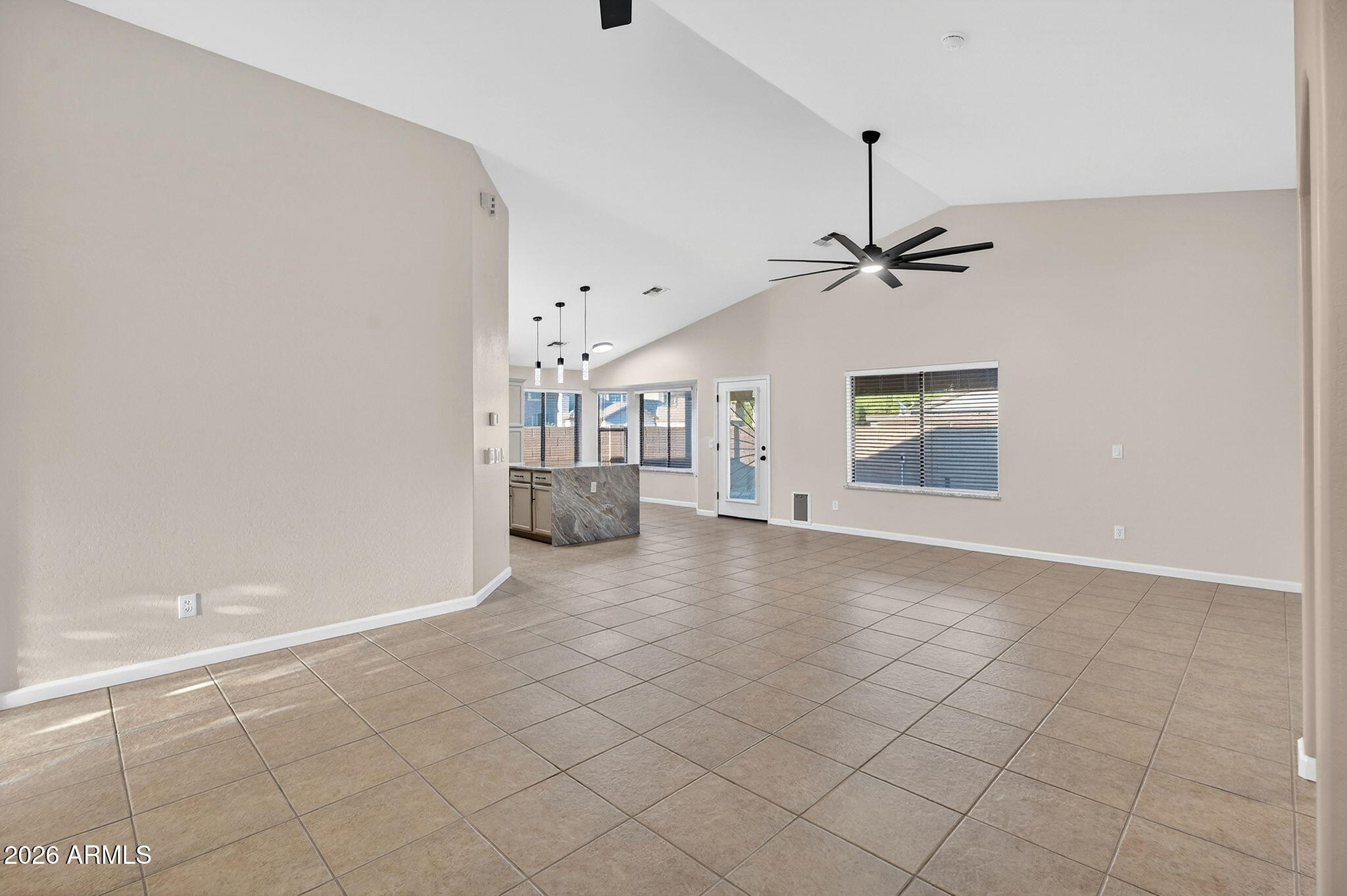 1815 South 174th Avenue Goodyear, AZ 85338 - Photo 10 of 57 a view of a livingroom with a ceiling fan and window