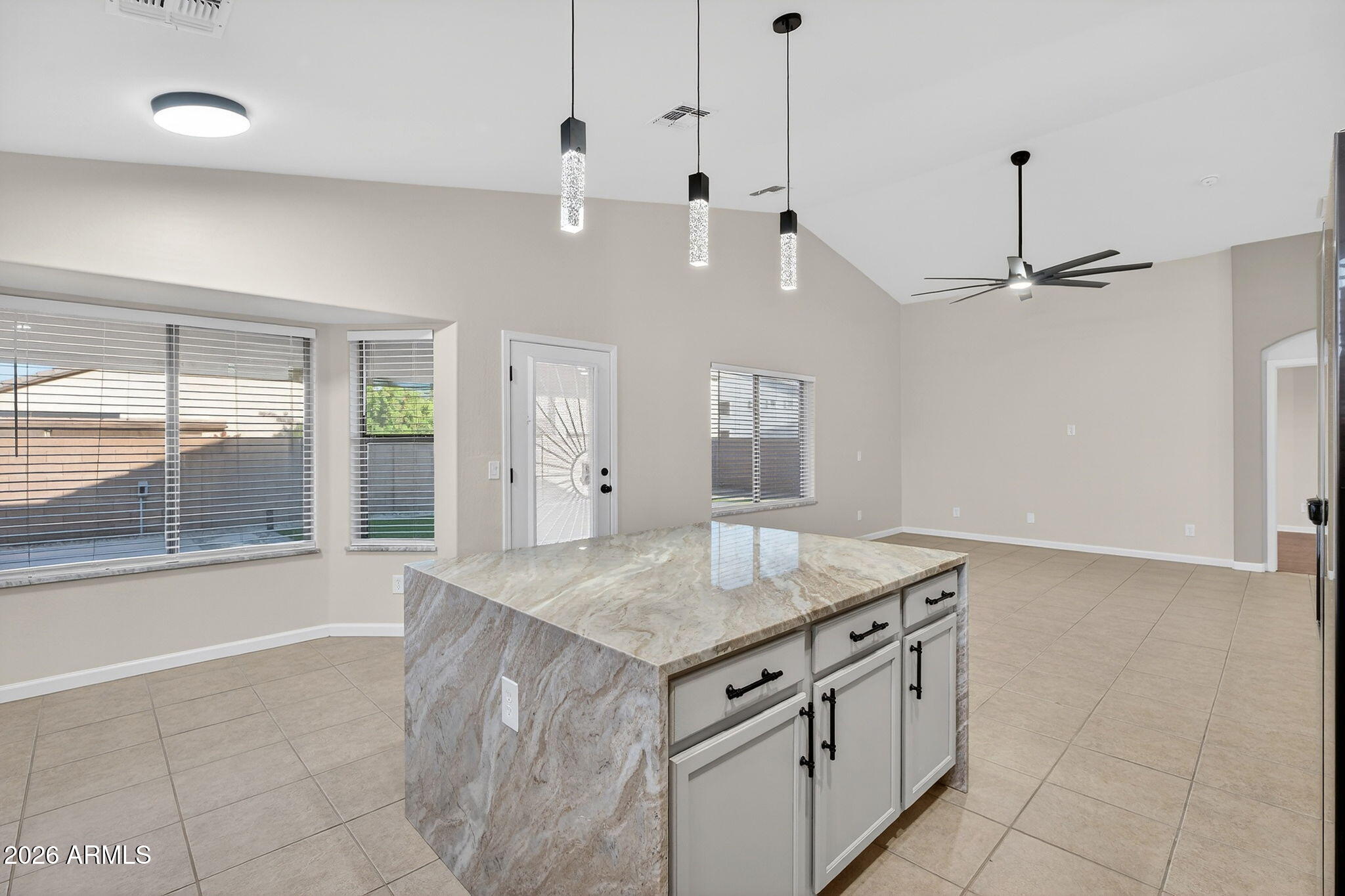 1815 South 174th Avenue Goodyear, AZ 85338 - Photo 15 of 57 a view of a kitchen with a sink and chandelier