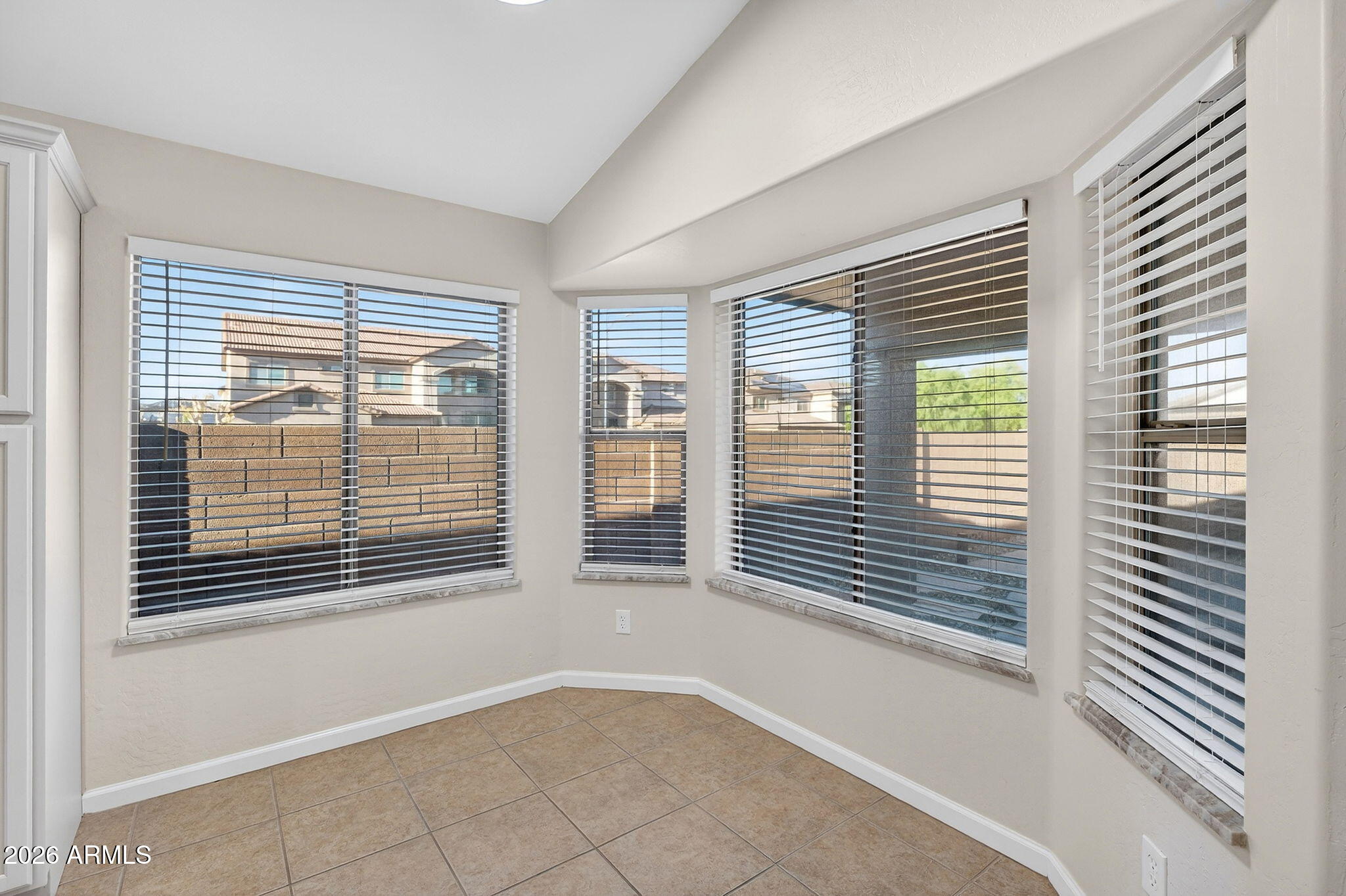 1815 South 174th Avenue Goodyear, AZ 85338 - Photo 16 of 57 a view of an empty room with a window