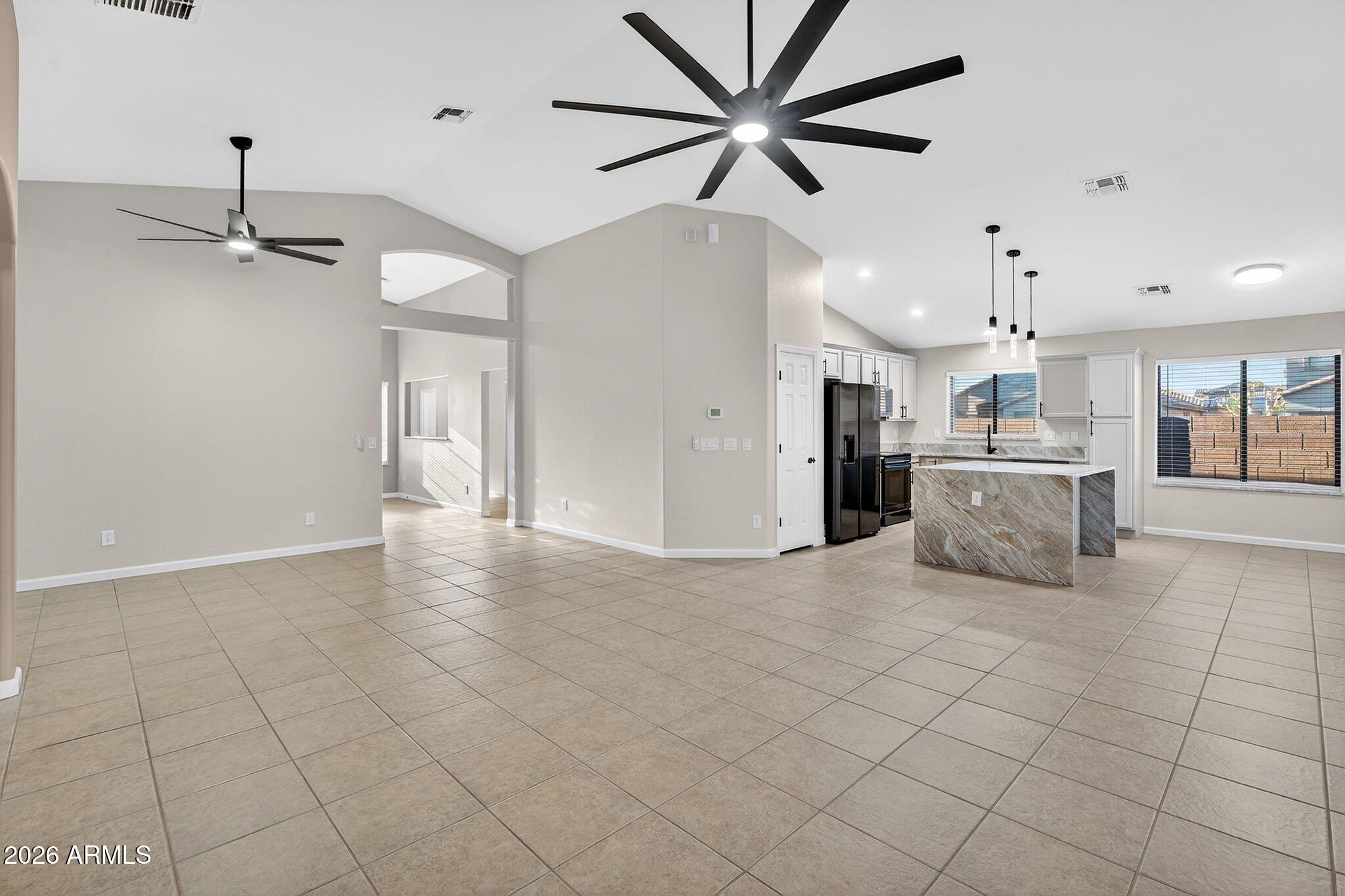 1815 South 174th Avenue Goodyear, AZ 85338 - Photo 57 of 57 a view of a kitchen with furniture and a ceiling fan