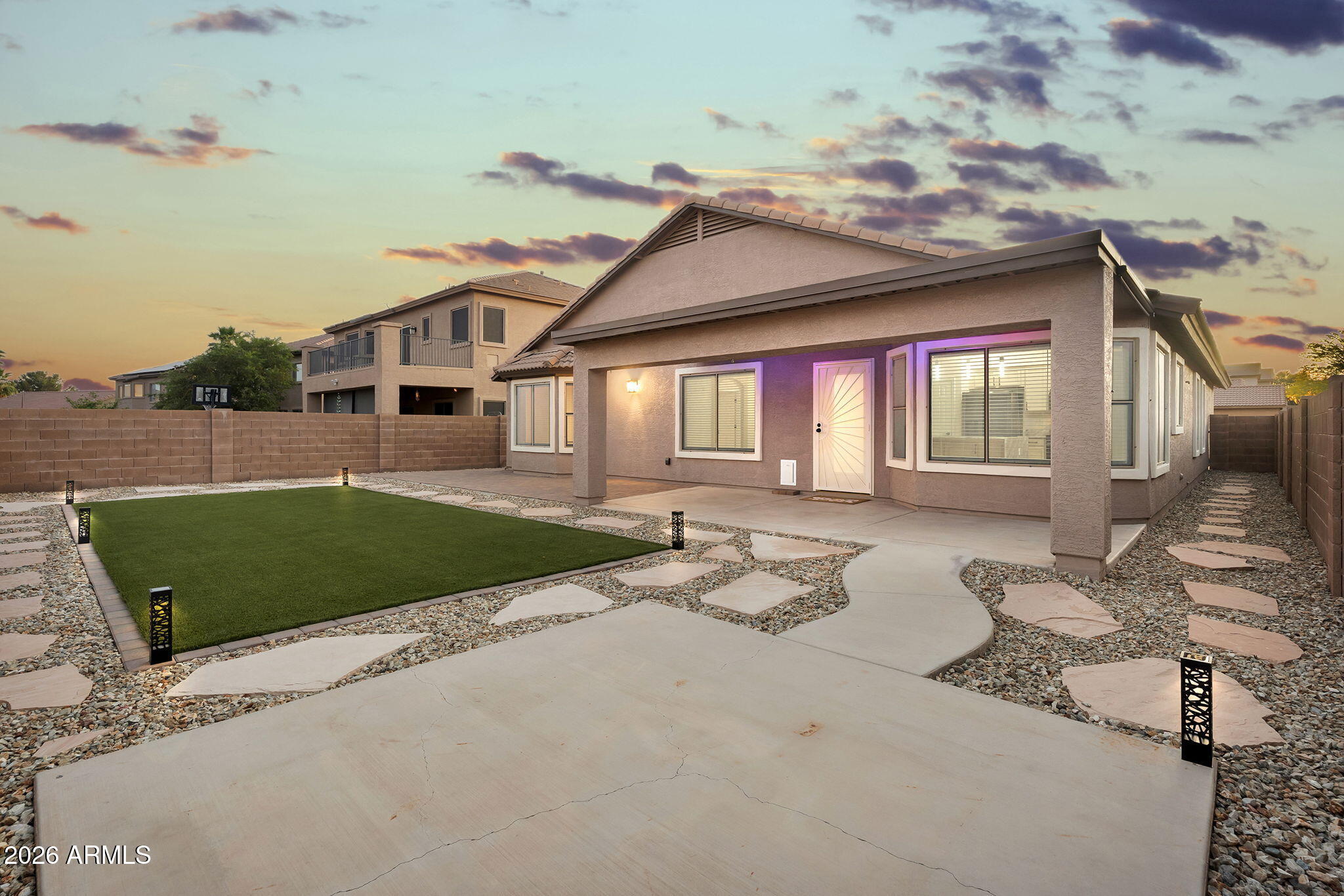 1815 South 174th Avenue Goodyear, AZ 85338 - Photo 21 of 57 a front view of a house with garden