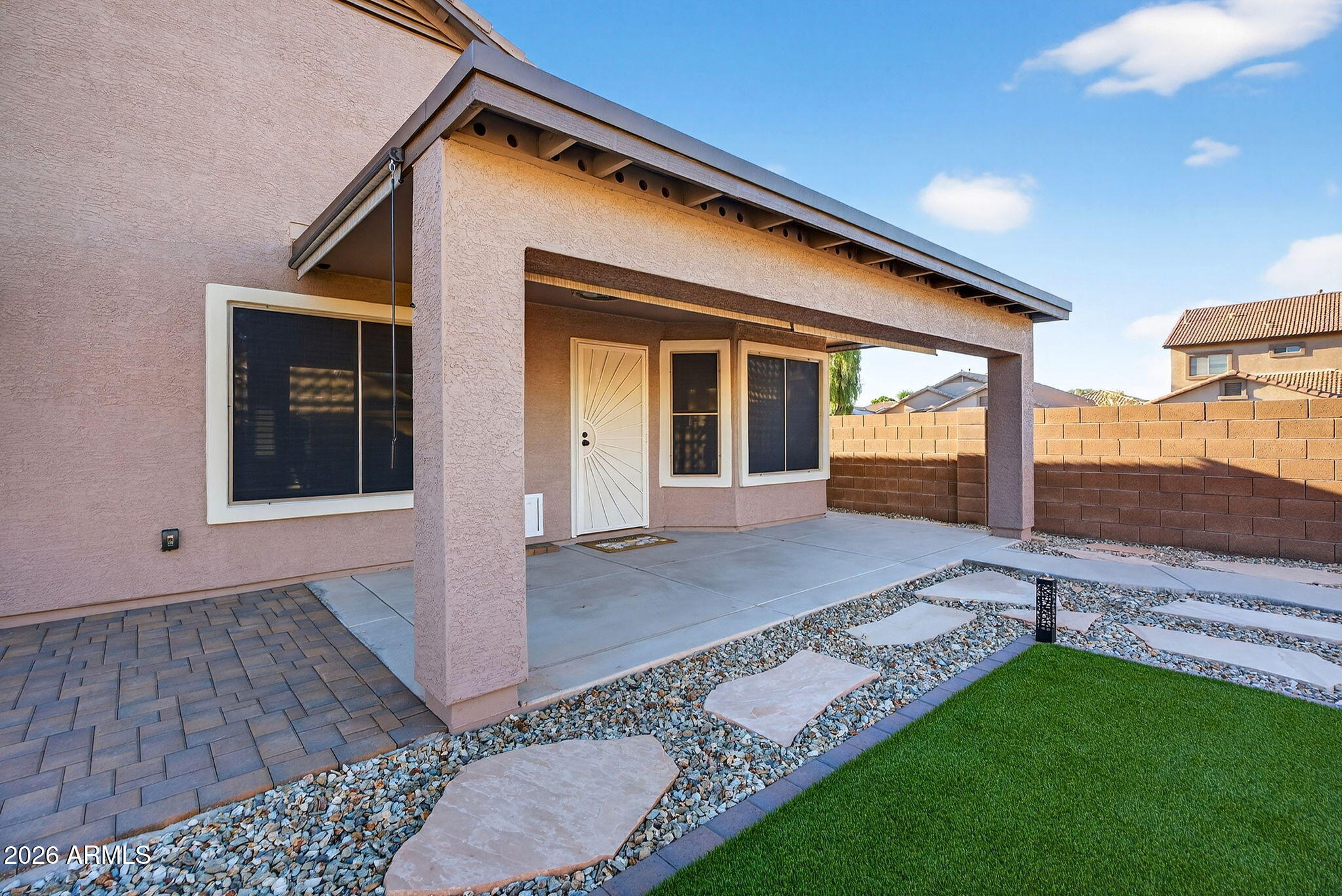 1815 South 174th Avenue Goodyear, AZ 85338 - Photo 27 of 57 a front view of a house with garden