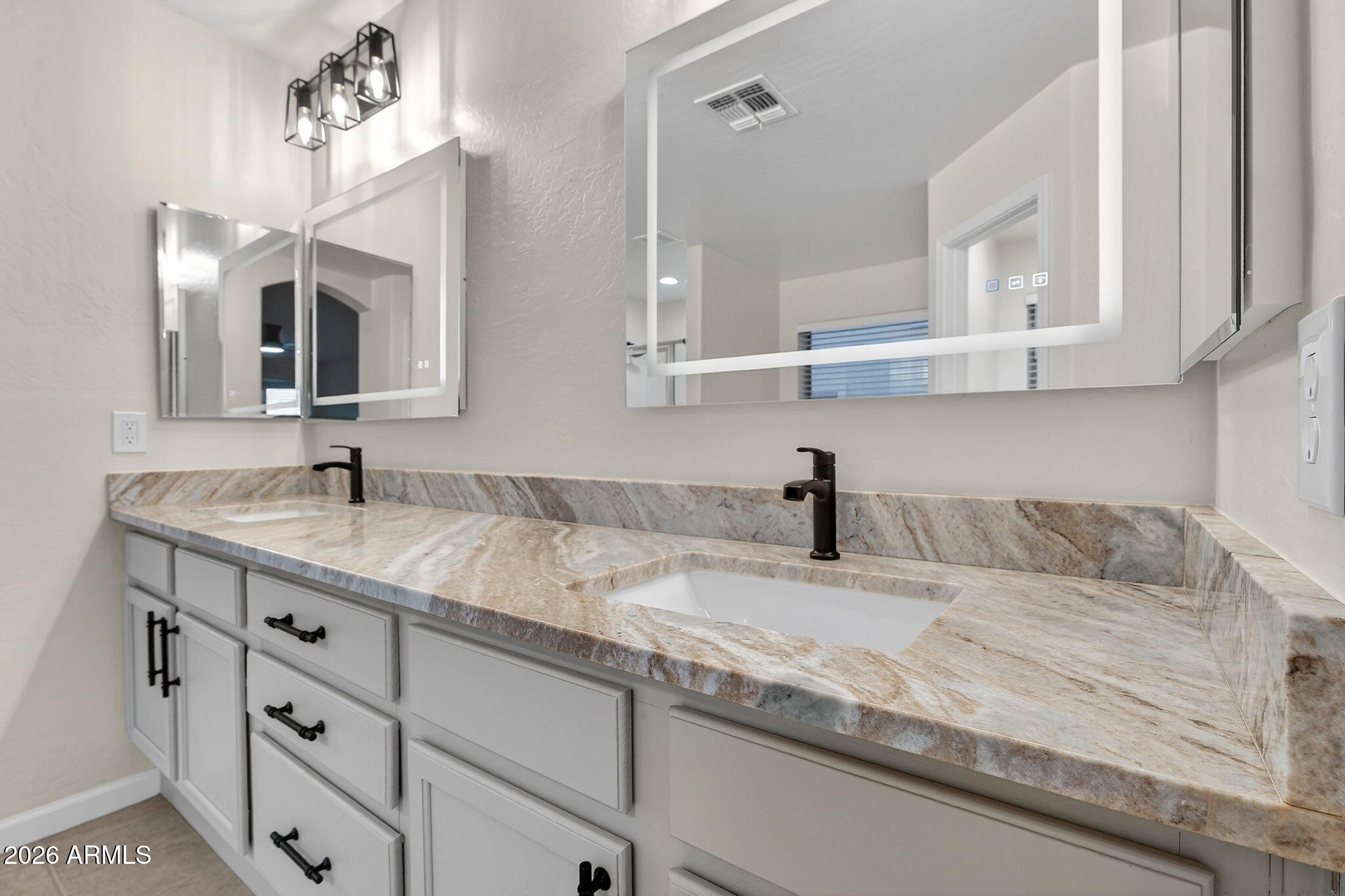 1815 South 174th Avenue Goodyear, AZ 85338 - Photo 34 of 57 a bathroom with a sink double vanity and a mirror
