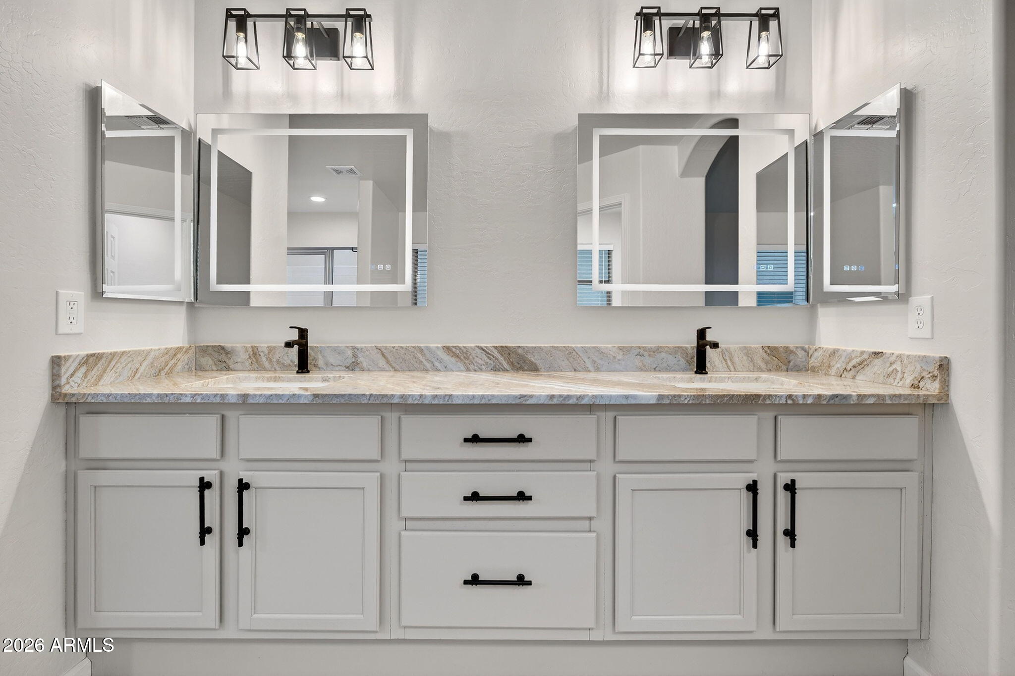 1815 South 174th Avenue Goodyear, AZ 85338 - Photo 35 of 57 a bathroom with double vanity white cabinets and a sink